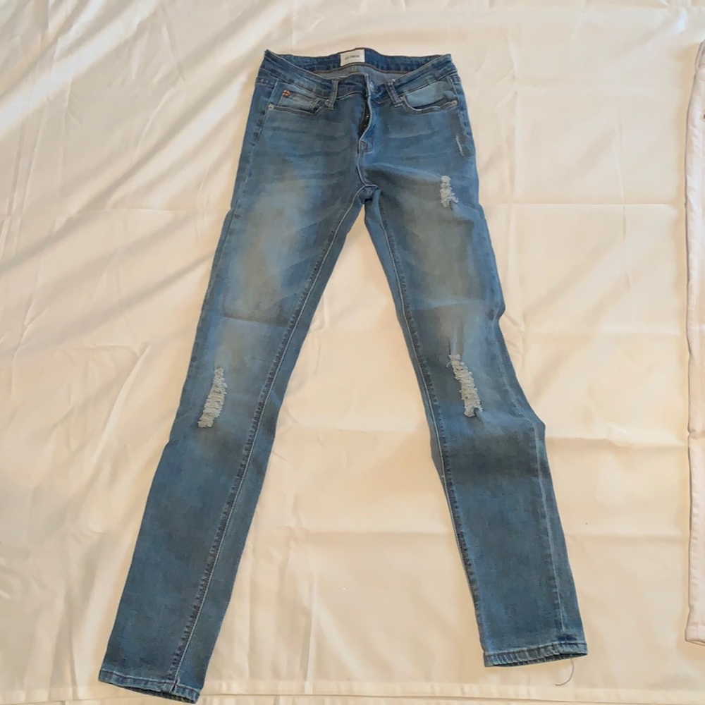 Hudson girls blue jeans with slight rip